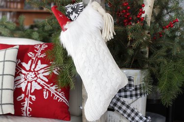 Instead of throwing out those sweaters that may have gotten a bit snug or gone out of style, you can give them a cozy new life as a Christmas decoration.