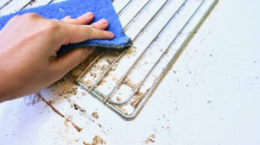 Scrubbing an oven rack