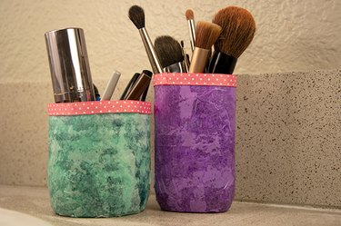 An image of make-up organizers made from old plastic bottles.