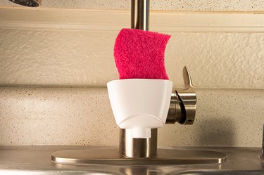 An image of a kitchen-sink sponge holder made from a body-wash bottle.