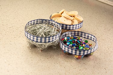 An image of a desk organizer made from plastic bottles.