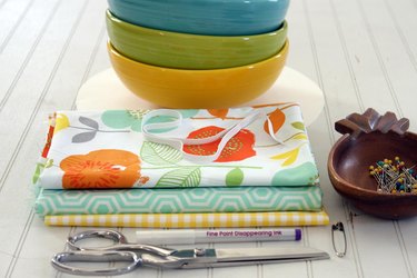 Get rid of the trash producing plastic wrap and create some colorful, reusable fabric bowl covers for all of your summer get togethers.