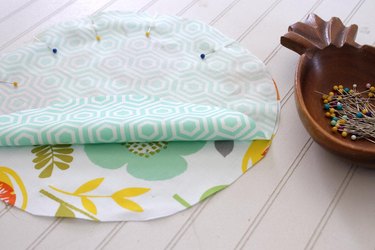 Get rid of the trash producing plastic wrap and create some colorful, reusable fabric bowl covers for all of your summer get togethers.