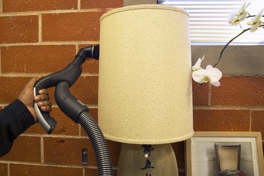 Remove dust from lampshades using a vacuum