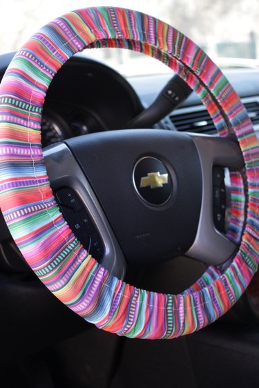 Adorn the interior of your car with a colorful, handmade steering wheel cover.