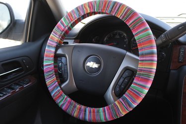 Adorn the interior of your car with a colorful, handmade steering wheel cover.