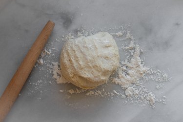 Roll out the dough on a lightly floured surface.