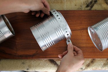 Steel stripes to hold cans on wood