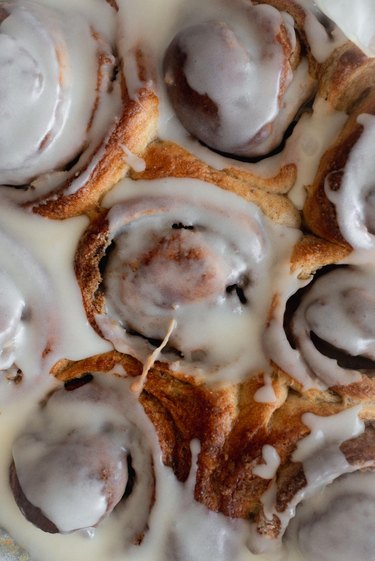 Cover the top of the cinnamon rolls with the cream cheese frosting.