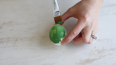 Painting egg green