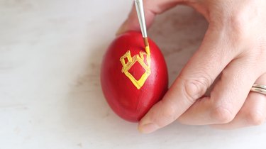 Painting Iron Man's mask on Easter egg