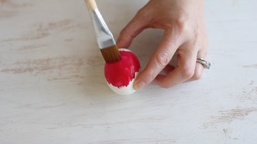 Painting egg red