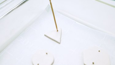Poking holes in polymer clay with toothpick