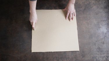 Cutting slits on each side of cardboard