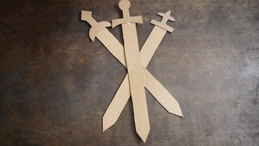 Three cardboard swords