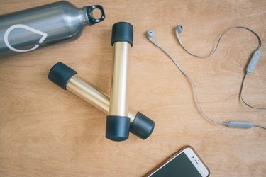 DIY gold and black dumbbells with PVC pipes