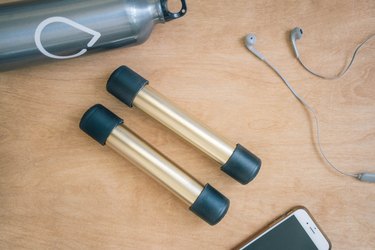 DIY gold and black dumbbells with PVC pipes