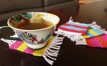 Cup of tea sitting on woven coaster