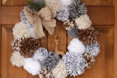 Pom pom wreath on front door