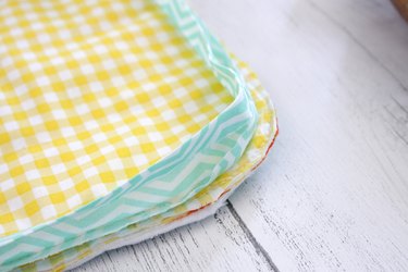 Sew a double pot holder so you can slide your hands into each of the pockets and grab that hot pan right out of the oven.