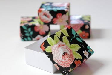 Make a big dramatic statement with a little paper box. They're perfect for those times when you need to add a little flair to a small gift for a friend or loved one. They even make great little wedding favor boxes.