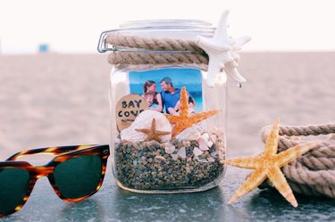 Glass mason jar filled with precious beach memories