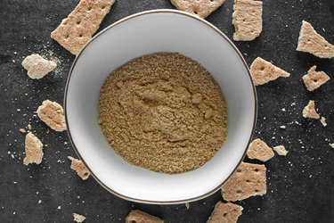 Crush graham crackers into crumbs