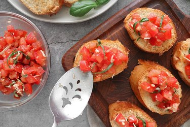 Spoon tomatoes onto the bread