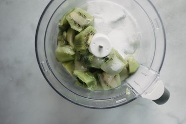 Add the ingredients into the bowl of a food processor.
