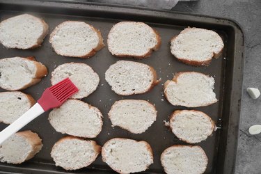 Brush bread with olive oil