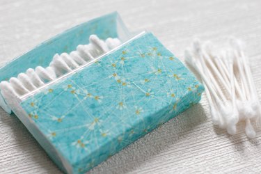 Transform empty plastic gum holders into first aid kits, sewing kits, gift card holders, and q-tip holders.