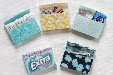 Transform empty plastic gum holders into first aid kits, sewing kits, gift card holders, and q-tip holders.