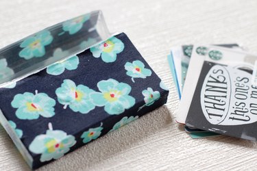 Transform empty plastic gum holders into first aid kits, sewing kits, gift card holders, and q-tip holders.