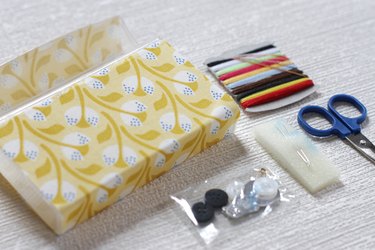 Transform empty plastic gum holders into first aid kits, sewing kits, gift card holders, and q-tip holders.