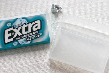 Transform empty plastic gum holders into first aid kits, sewing kits, gift card holders, and q-tip holders.