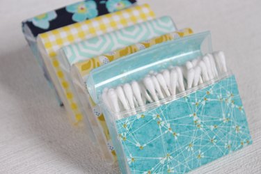 Transform empty plastic gum holders into first aid kits, sewing kits, gift card holders, and q-tip holders.