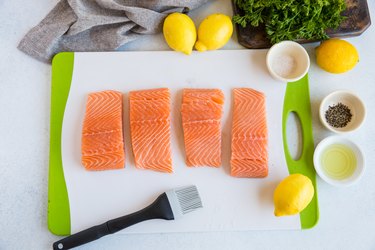 salmon fillets on a cutting board