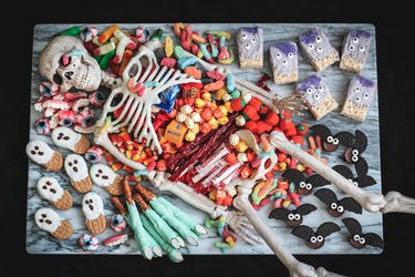 Skeleton party platter with candy and desserts