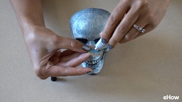 Gluing pear-cut gemstone applique to skull