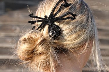A fake spider can nestle in your hair