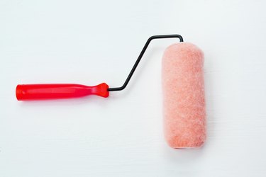 Close-Up Of Paint Roller On White Table