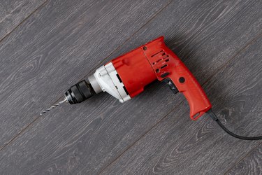 view from above of the simple single red drill work tool, copy space flat lay