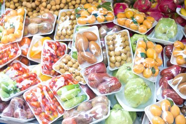 Assorted wrapped packages of various fruits and vegetables