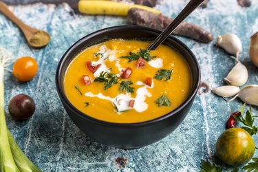 Sweet potato soup with carrot, tomato, leek, garlic, parsley and cumin
