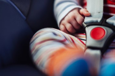 Baby in car seat.