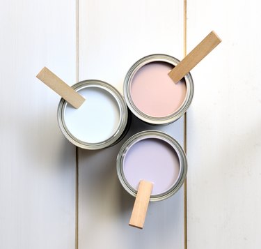 cans with brown, white and lavender paint
