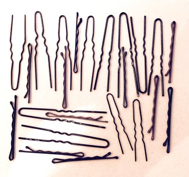 High Angle View Of Hairpins Against White Background