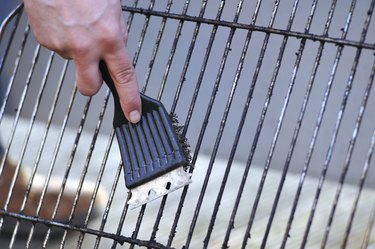 Cleaning the grill with scrubber