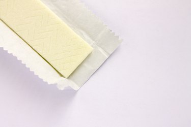 Plate of chewing gum in an open wrapper on a white background