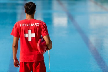 Lifeguard watching swimming pool